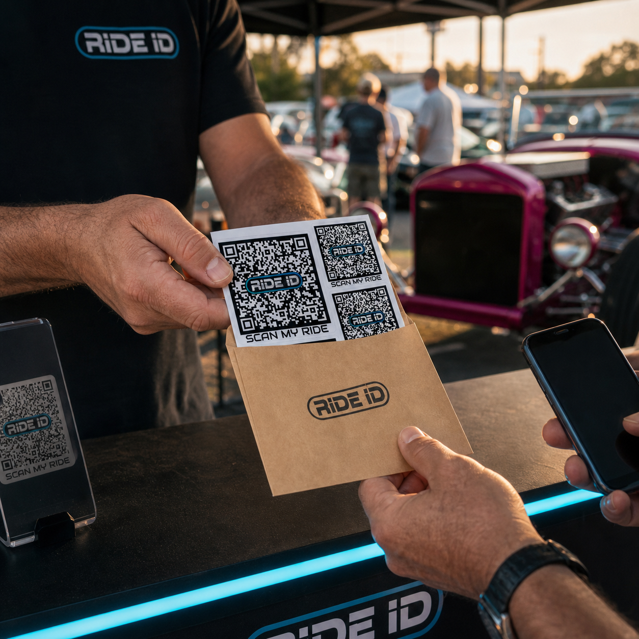 RideID QR redemption gift set being handed to a new member at a car show